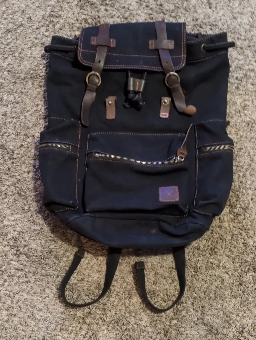 Classic Black Canvas Backpack with Brown Leather Accents